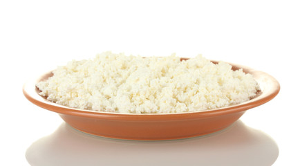 Cottage cheese in a plate isolated on white