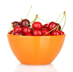cherry in a orange bowl isolated on white