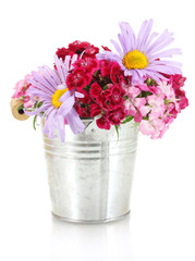 beautiful bouquet of bright wildflowers in bucket, isolated