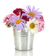 beautiful bouquet of bright wildflowers in bucket, isolated
