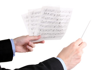 Fototapeta premium Music conductor hands with baton and notes isolated on white
