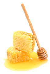 golden honeycombs with honey isolated on white.