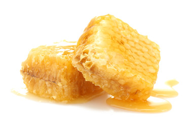 golden honeycombs with honey isolated on white.