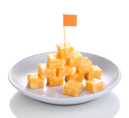 Cheese pyramid on plate isolated on white