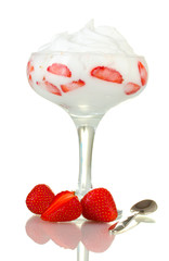 glass of ripe strawberries with cream isolated on white