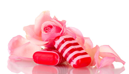 Two soap and pink rose isolated on white