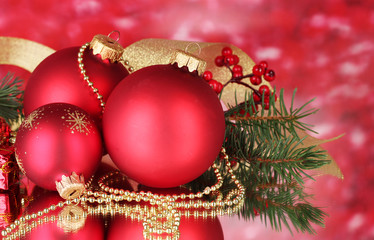 Christmas ball and green tree on red