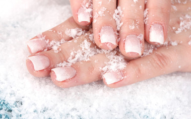 Fototapeta premium beautiful hands with snow closeup