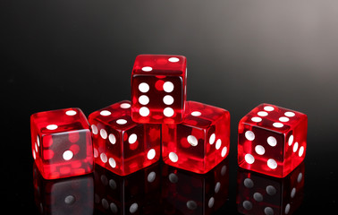 Red dices on grey background