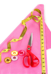 Scissors, buttons, measuring tape and pattern
