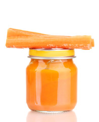 Jar of baby puree with carrot isolated on white