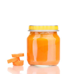 Jar of baby puree with carrot isolated on white