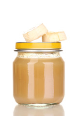 Jar of baby puree with banana isolated on white