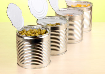 Open tin cans of peas, corn, bean and french bean
