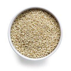 Sesame Seeds in White Bowl over White Overhead View