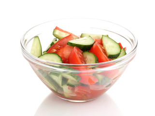 Fresh salad with tomatoes and cucumbers isolated on white