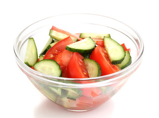 Fresh salad with tomatoes and cucumbers isolated on white
