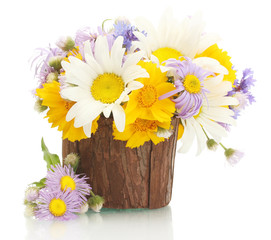 bouquet of wildflowers in watering can isolated on white