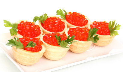 Red caviar in tartlets on white plate isolated on white