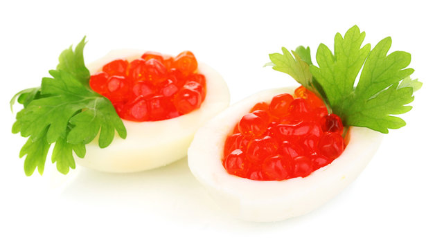 Red caviar in eggs isolated on white