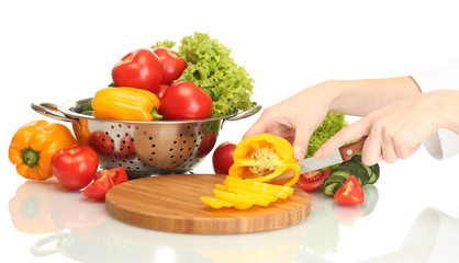 vegetables and knife on cutting board isolated on white