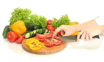 vegetables and knife on cutting board isolated on white