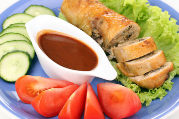 Tasty meat cutlet with garnish on plate close-up