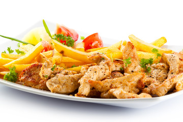 Grilled meat French fries and vegetables on white background