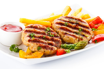 Grilled steak, French fries and vegetables