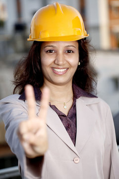 Young Indian Architecture Showing Victory Sign