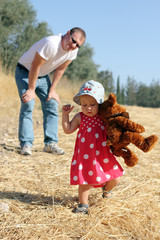 father and daughter in the autumn meadow