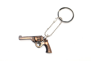 Toy gun with key chain on white background