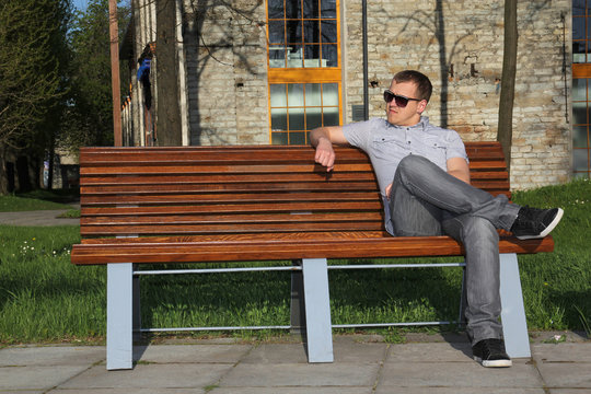 Man sitting in park on the bench