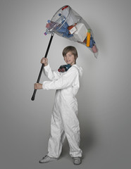 Yound man's hand holding butterfly net, catching objects polluti