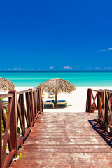 Walkway leading to a tropical beach in Cuba