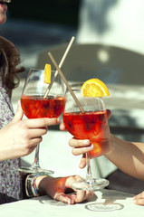 two young girls while they take a cocktail