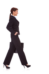 business woman walking with a briefcase