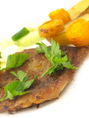 roasted meat with focus on fresh parsley