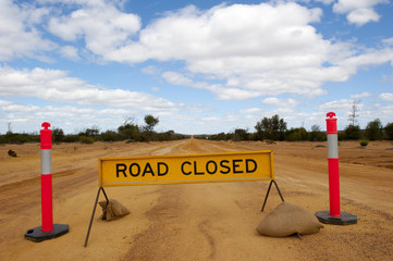 Slippery dirt Road Closed Outback Australia
