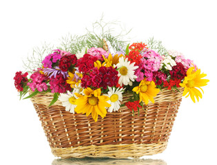 beautiful bouquet of bright  wildflowers in basket, isolated