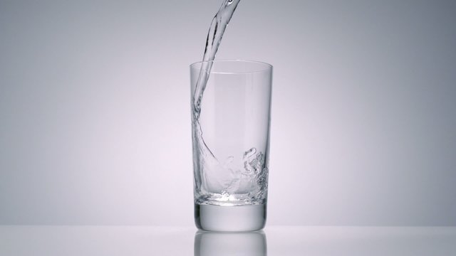 Water being poured in glass, Close-up, Slow Motion