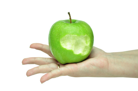 green apple on a female hand