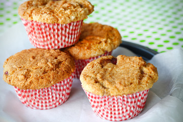 Freshly baked rhubarb cupcakes in a tray with baking paper