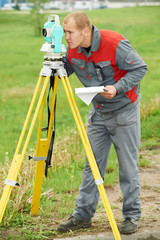 surveyor works with theodolite