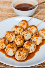 Roasted pork ball pour with sweet spicy sauce