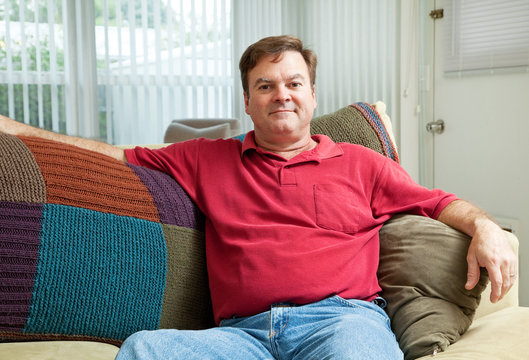 Mid Adult Man Relaxing At Home