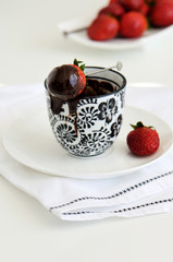 Strawberry dipped in chocolate fondue,