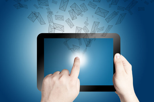 hand Holding Tablet PC with mail icon coming out