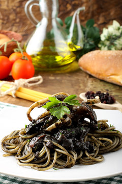 Pasta with squid ink and fresh tomatoes