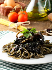 Pasta with squid ink and fresh tomatoes